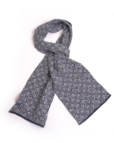 elegant grey scarf with a detailed brown geometric pattern and solid brown edges